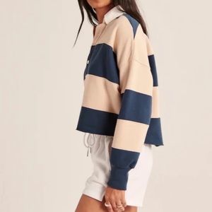 Abercrombie and Fitch Rugby Shirt in navy/ tan stripes. Size medium.